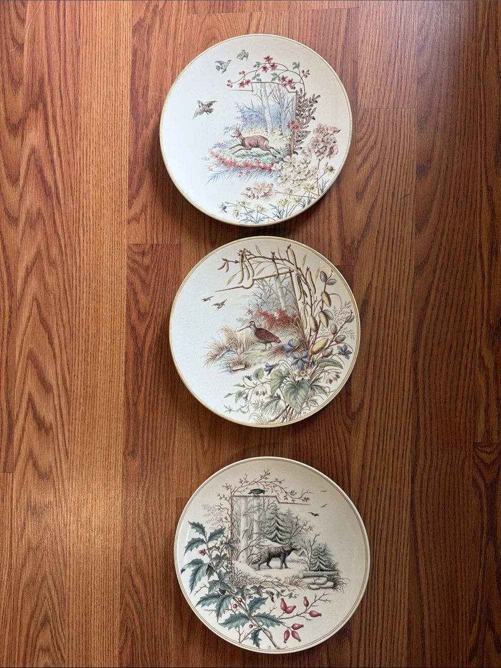 A set of 3 antique wildlife plates. Neutral tones  